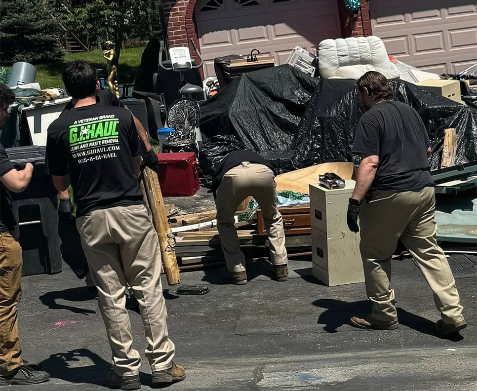 close-up of G.I.HAUL employees moving furniture