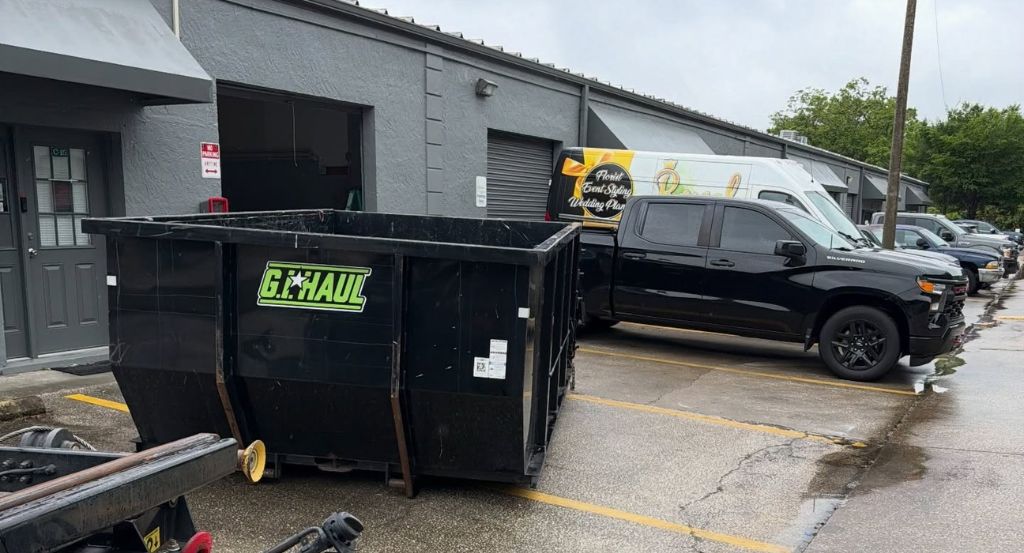 Commercial dumpster in business parking lot
