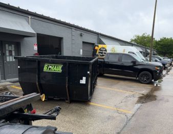 Dumpster in the parking lot of a business