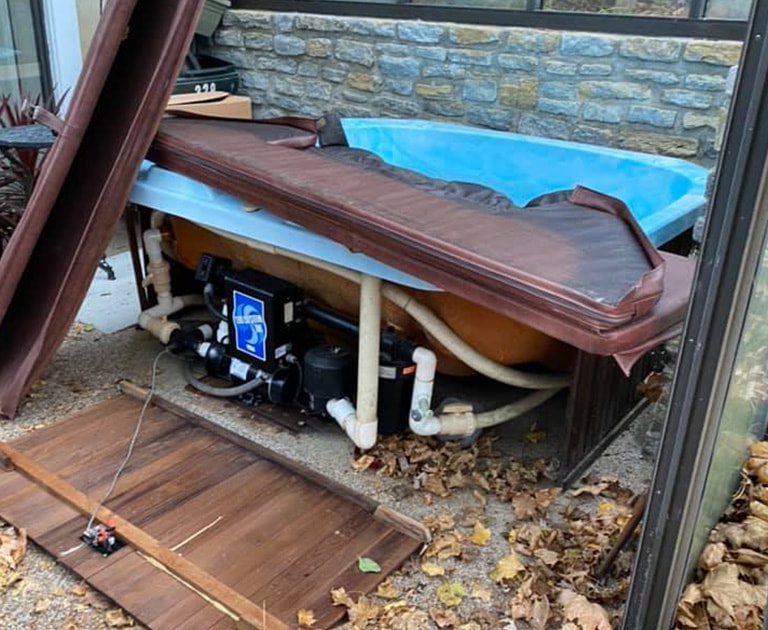close-up of destroyed hot tub before removal