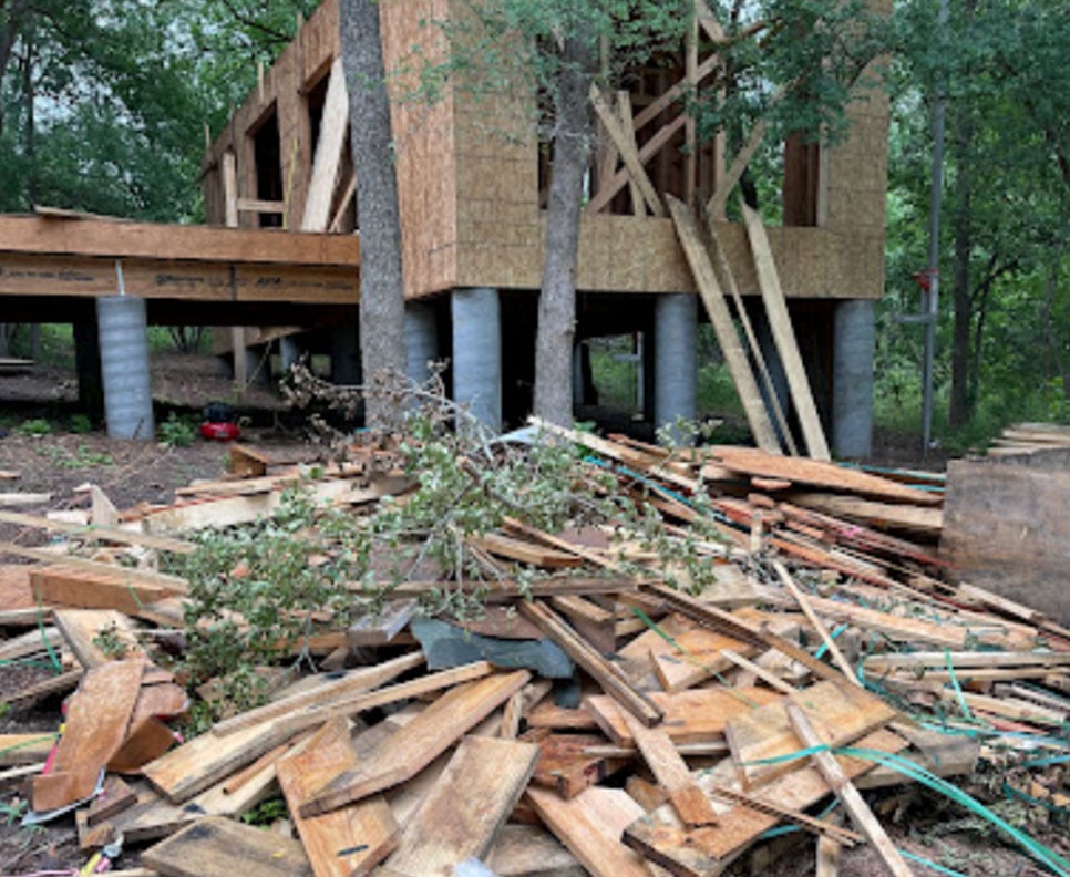 commercial building tore down with lumber everywhere