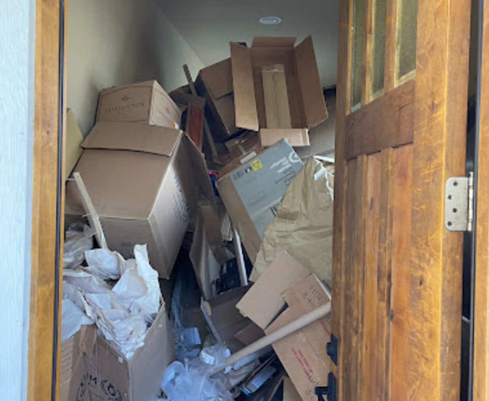 boxes piled to ceiling in hoarder's home
